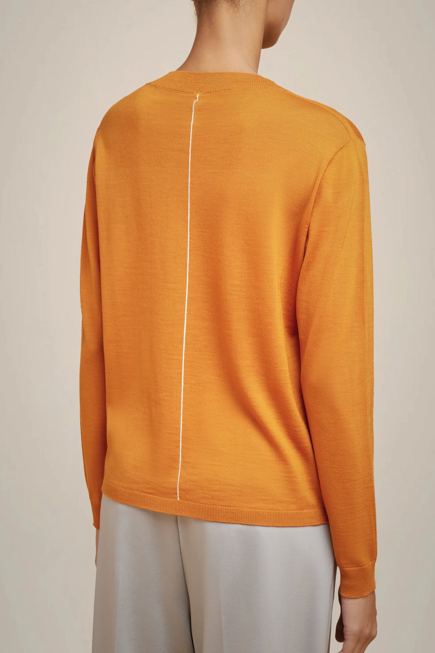 JERSEY NARANJA DE CUELLO PICO DE LIVIANA CONTI