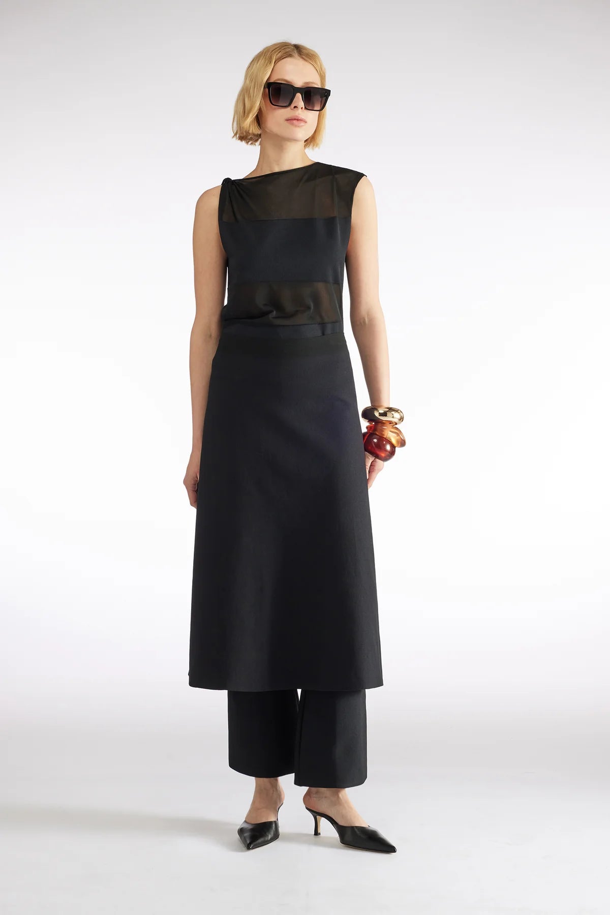 TOP AMB DETALLS TRANSPARENTS DE LIVIANA CONTI